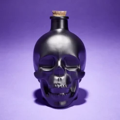 Bouteille poison décoration Halloween crâne en verre noir 10x8,5xH14cm