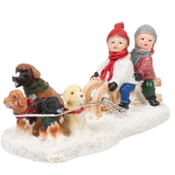 Personnage village de Noël enfants avec traineau et chiens