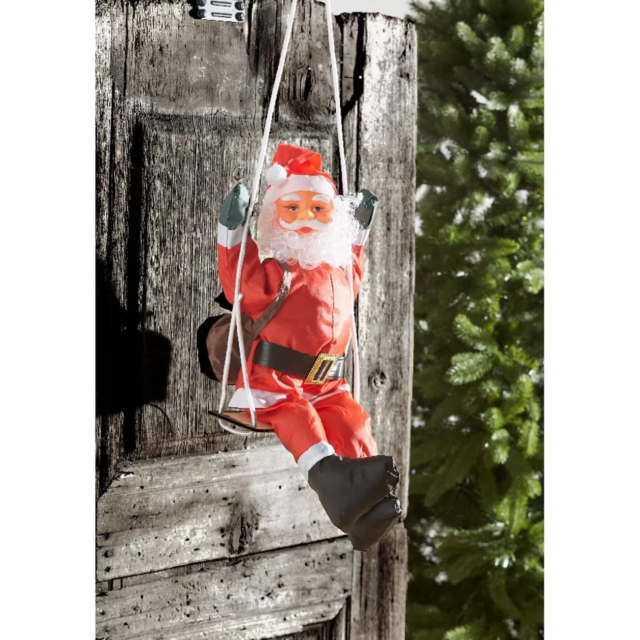 Père Noël grimpeur sur balançoire